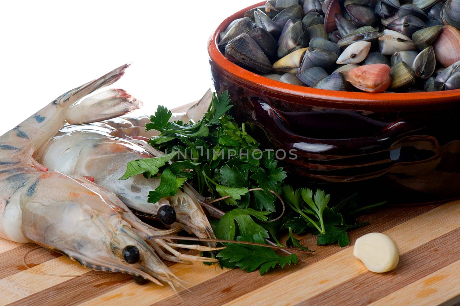 giant clams and shrimp on a wooden cutting board bamboo