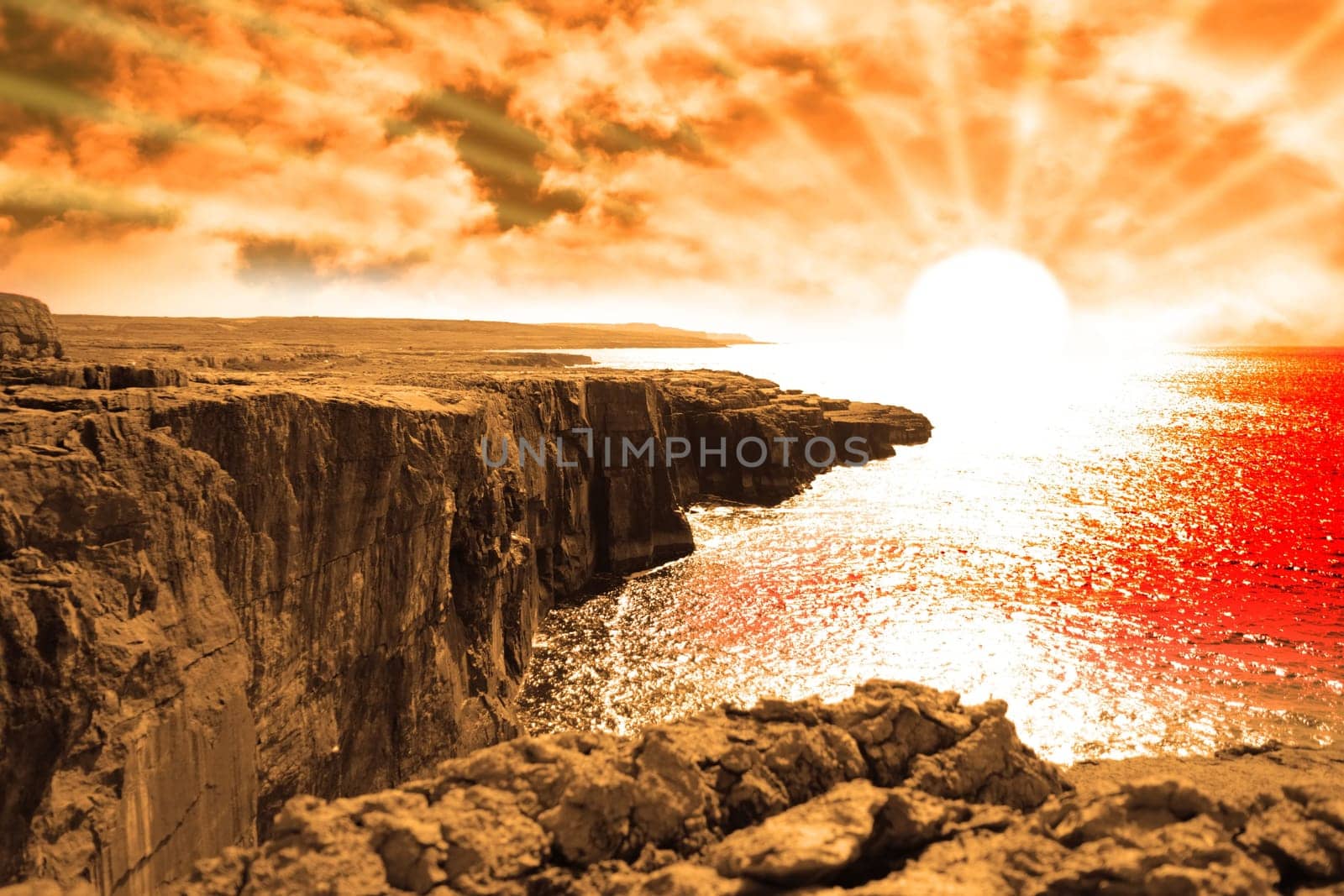golden sunset from the cliffs edge on a rocky landscape of the burren in county clare ireland