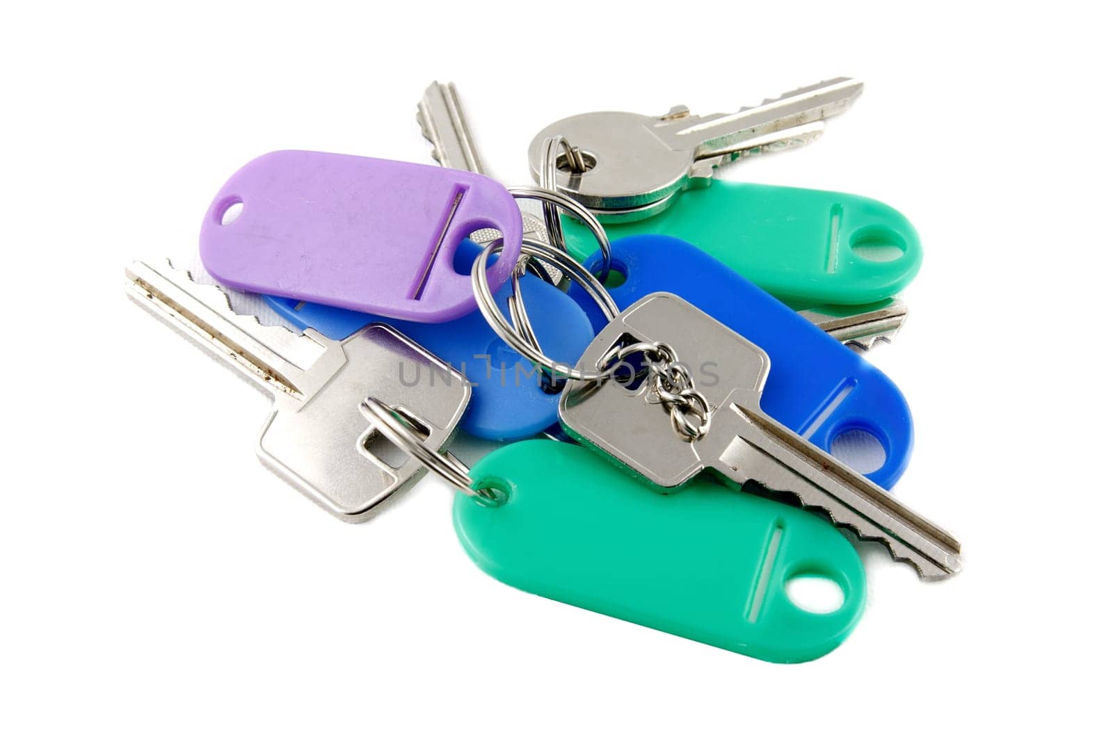 Old silver keys with keyholder on white background
