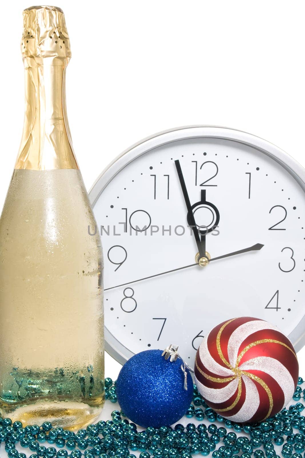 new year decoration.champagne, baubles and clock face.