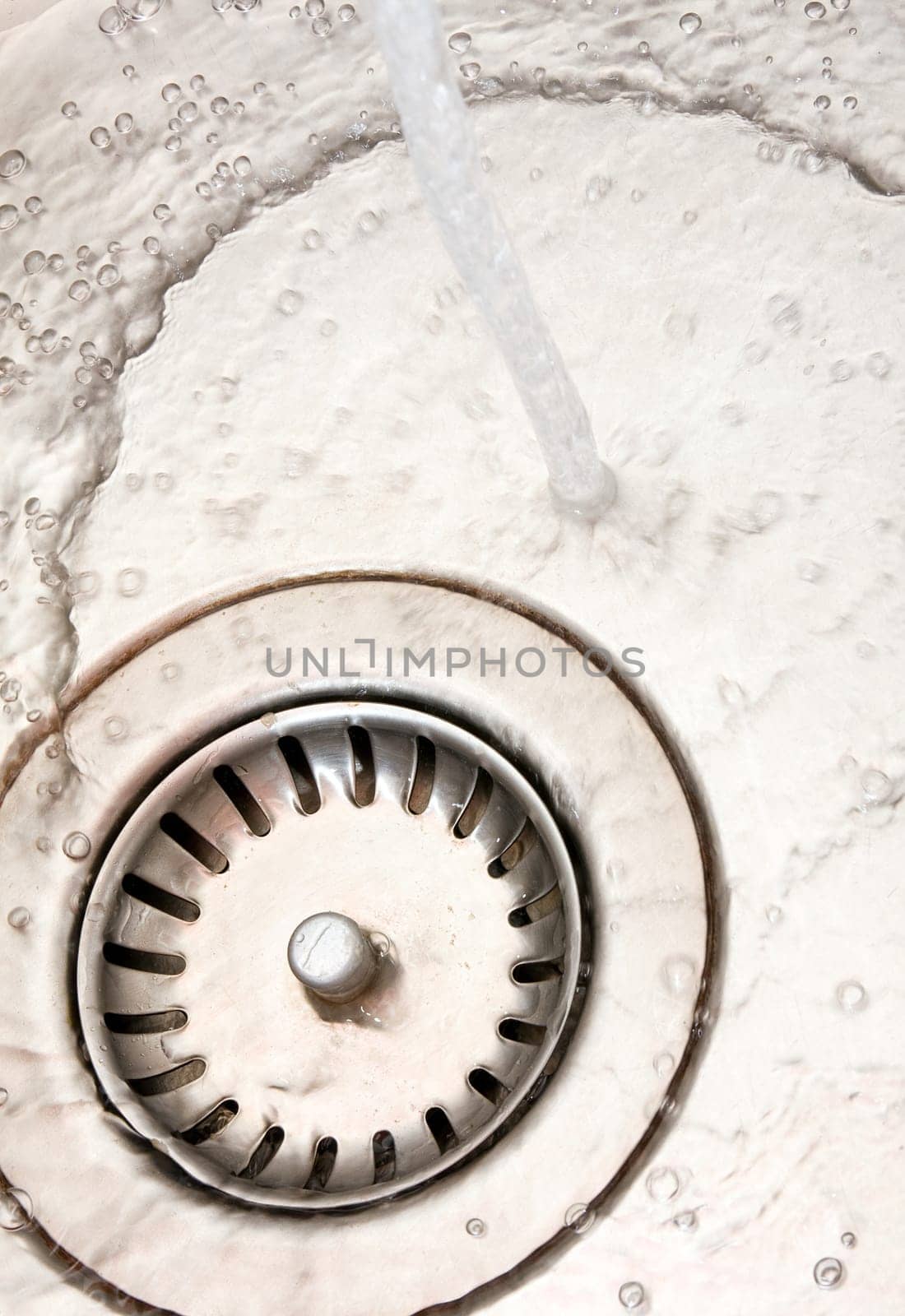 Close-up of kitchen sink with flowing water