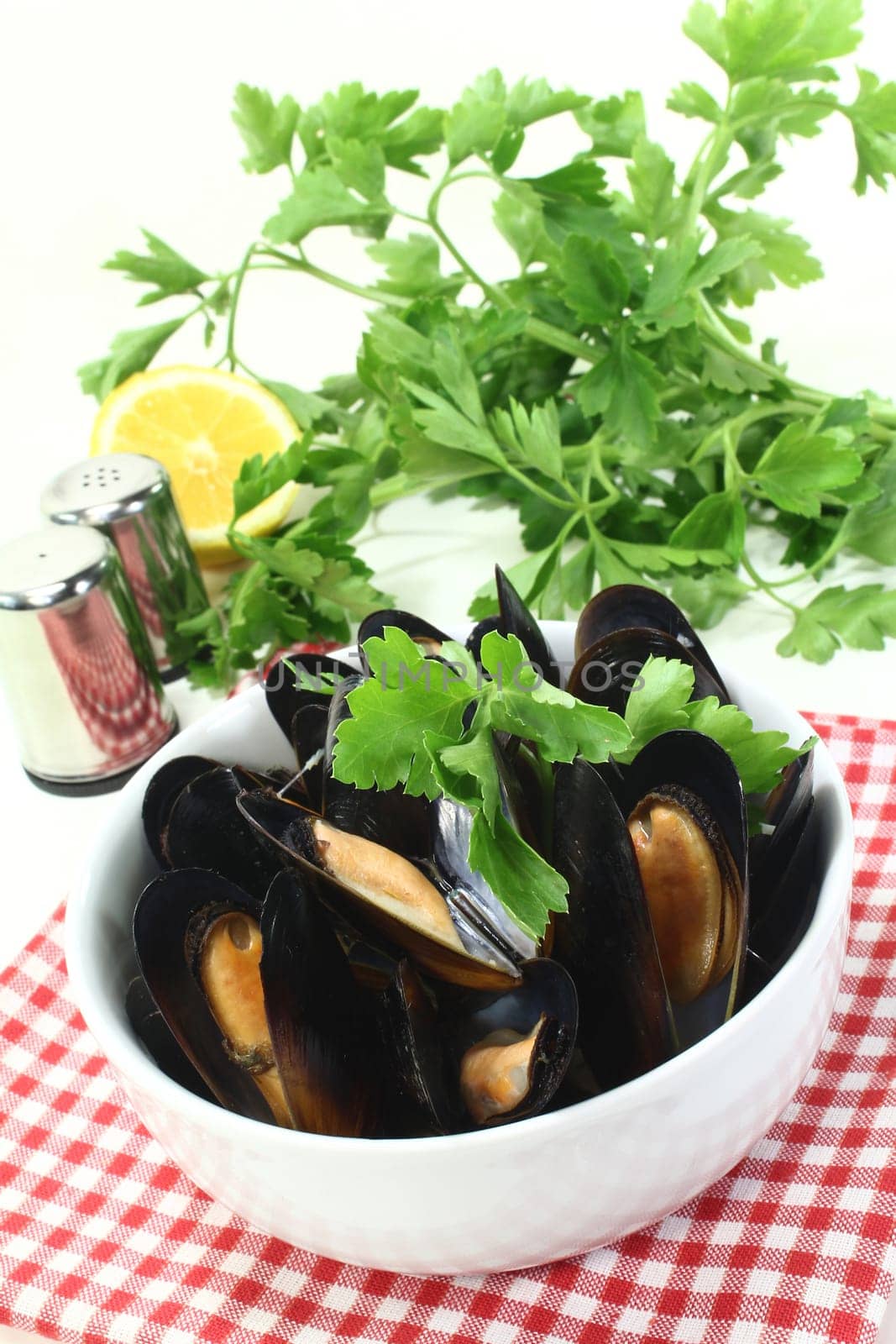 fresh cooked mussels in a white bowl