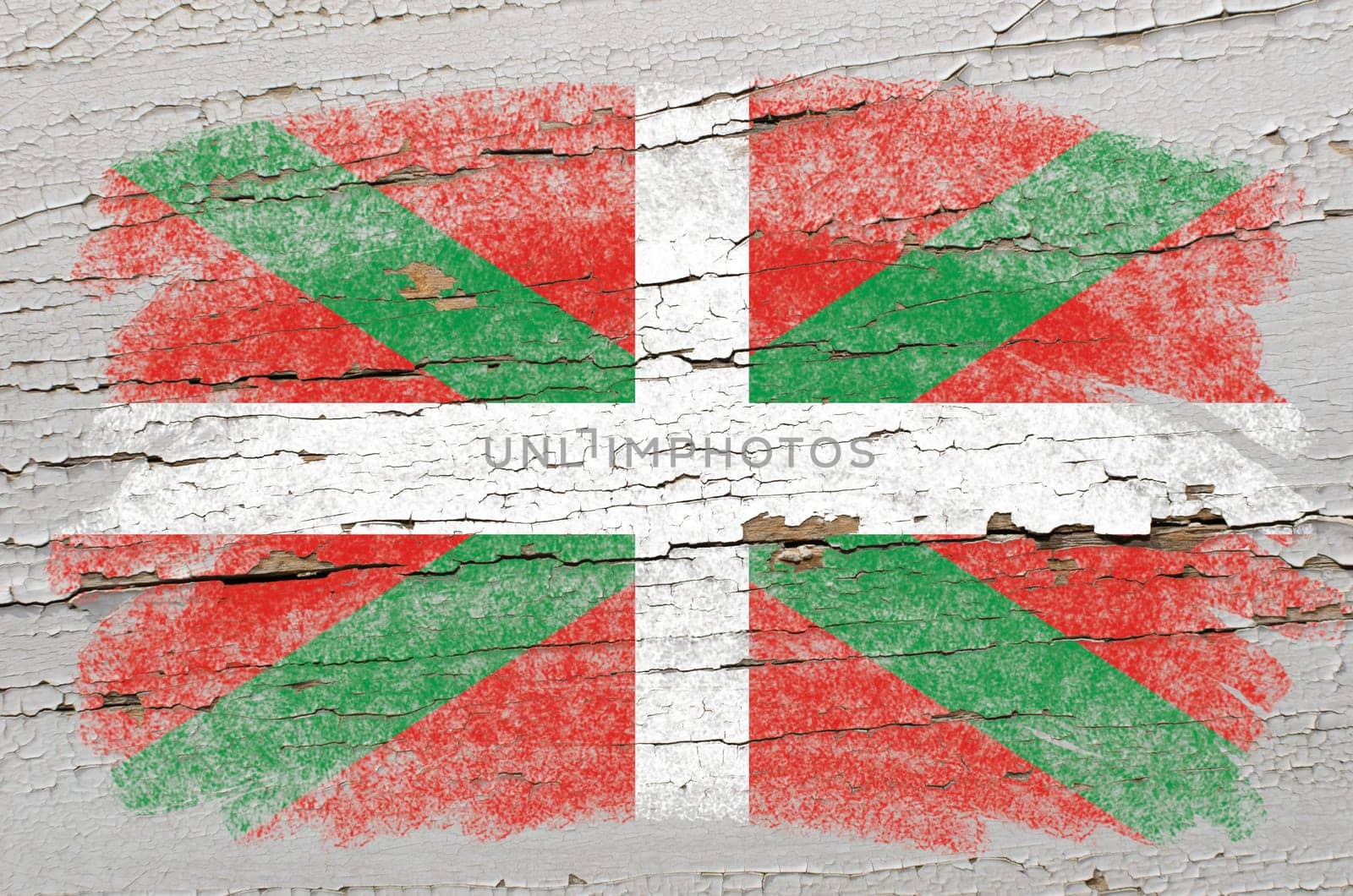 Chalky basque flag precisely painted with color chalk on grunge wooden texture