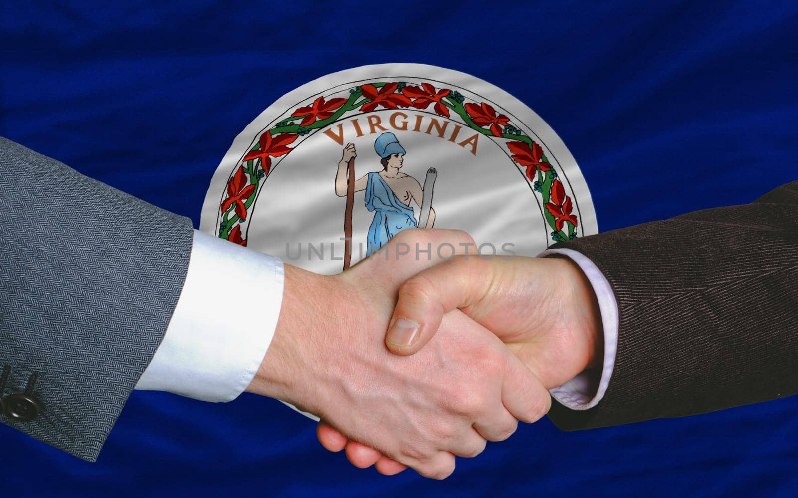 two businessmen shaking hands after good business investment agreement in front US state flag of virginia