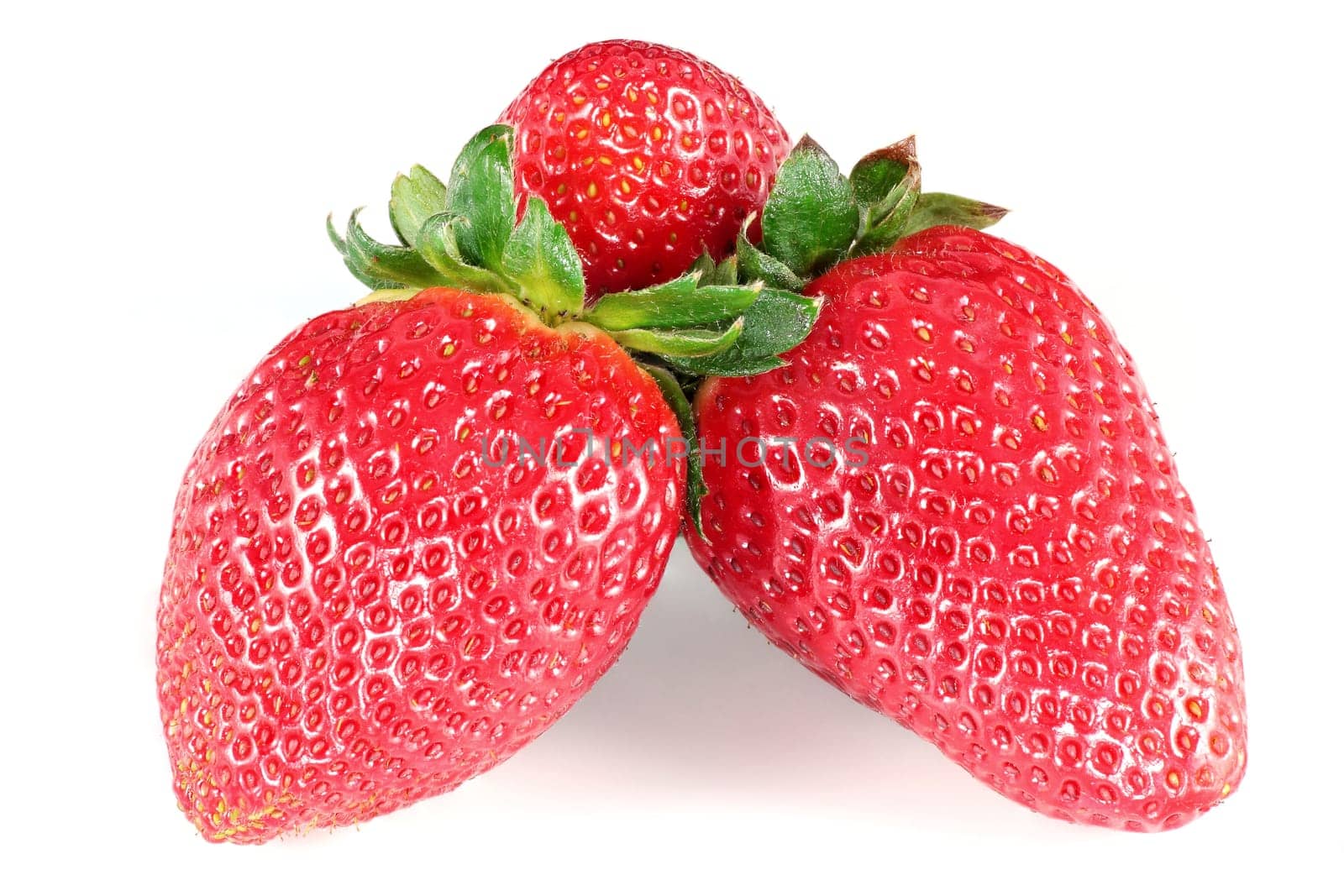 three horizontal juicy strawberries on white background