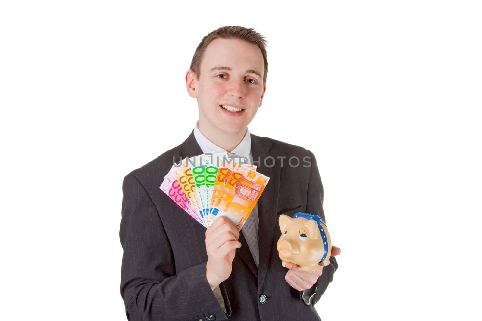 Young businessman with banknotes isolated on white background