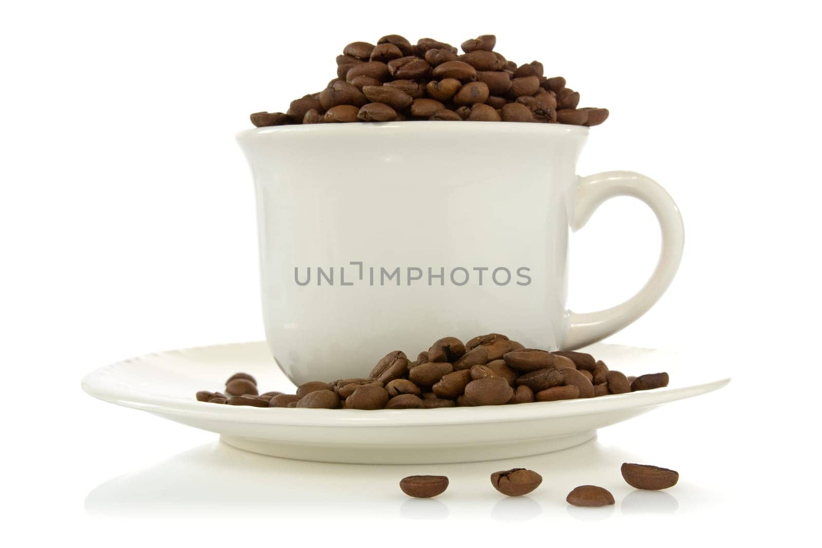 white cup full of roasted coffee beans