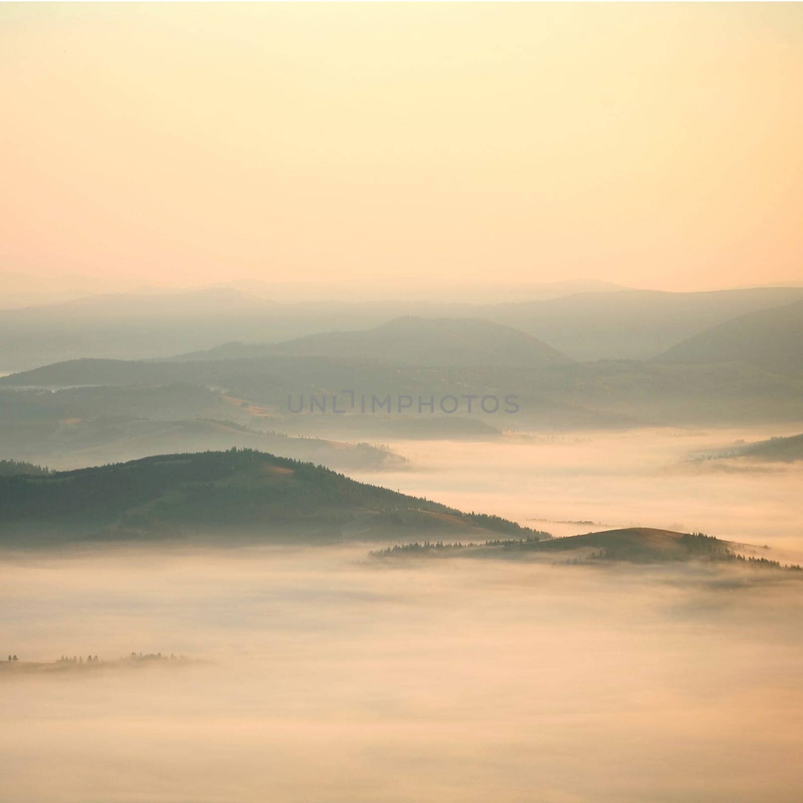 An image of yellow mist in the mountains