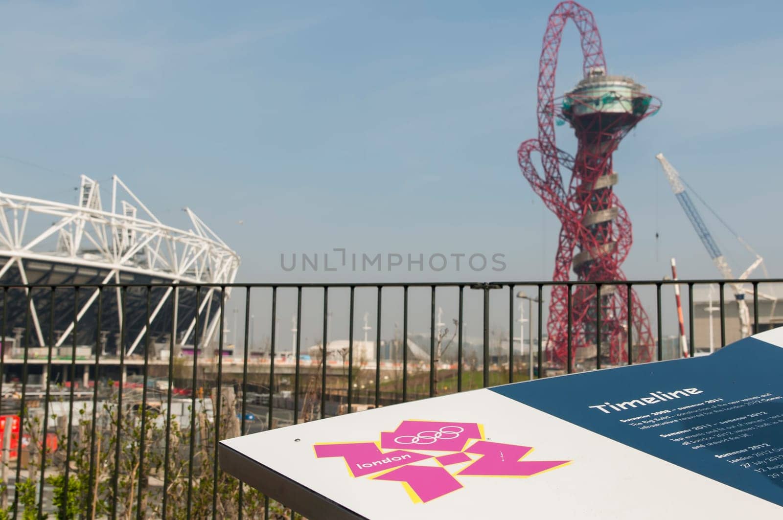 LONDON, UK – MARCH 24: Details of information board with London Olympics logo and Stadium and sculpture in the background on March 24, 2012 in London. The Olympic Park is due to be ready in summer.