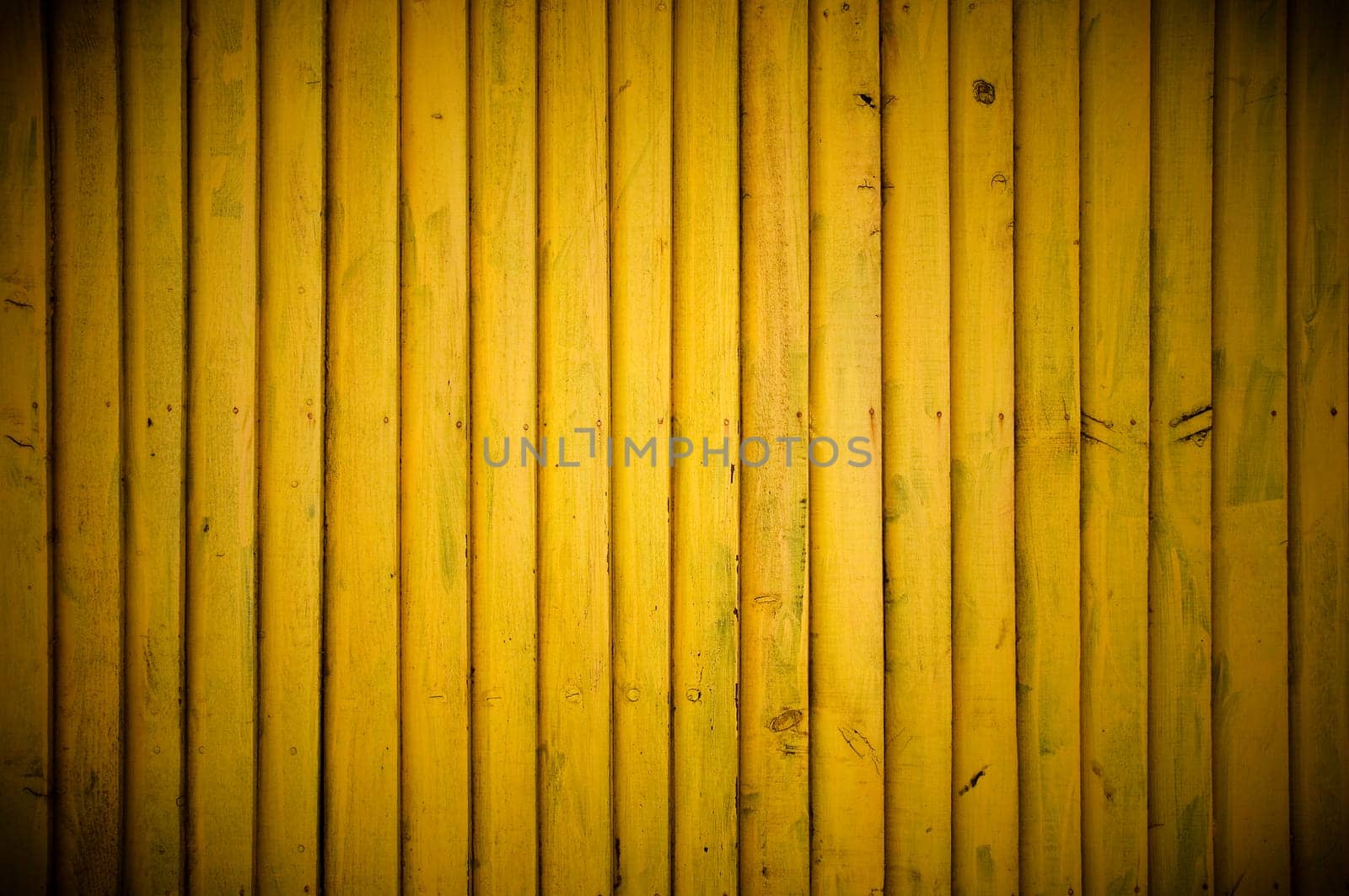 Yellow wood wall background with vignette