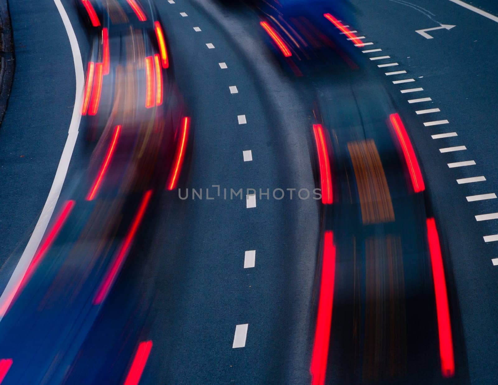 blurred lights of cars on a highway at evening