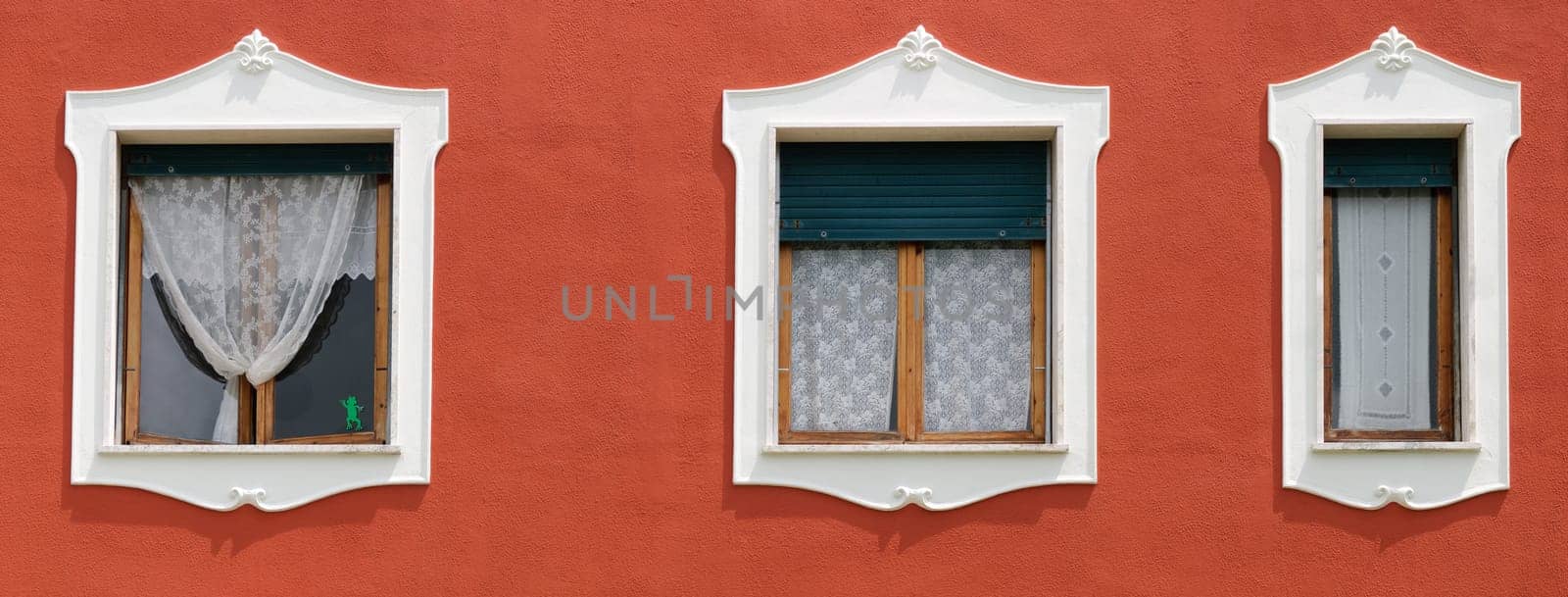 panoramic photo with three windows with decorations
