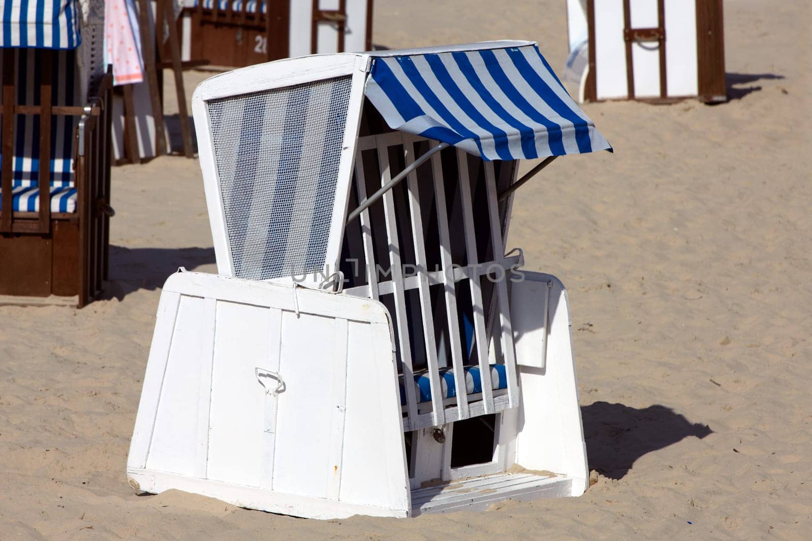 Single blue beach chair on the beach of the Baltic Sea