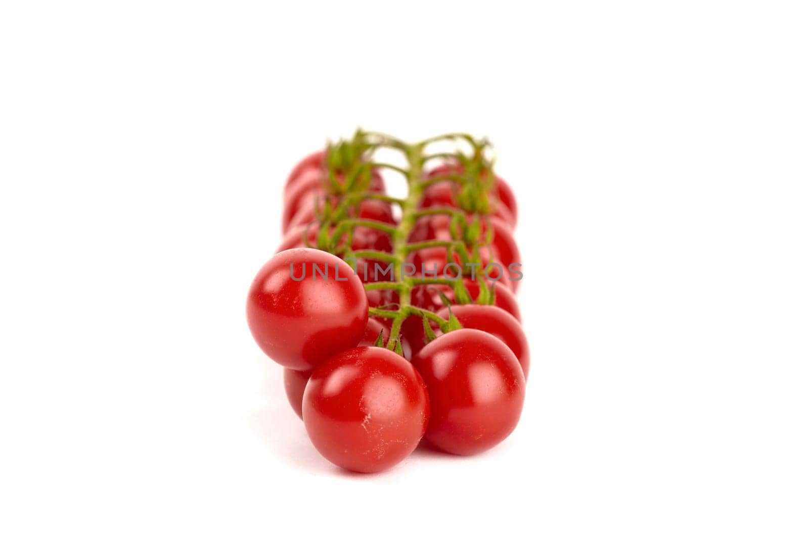 Cherry tomatoes isolated against white background