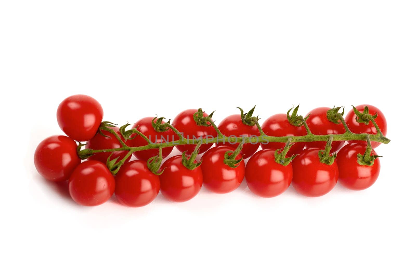 Cherry tomatoes isolated against white background