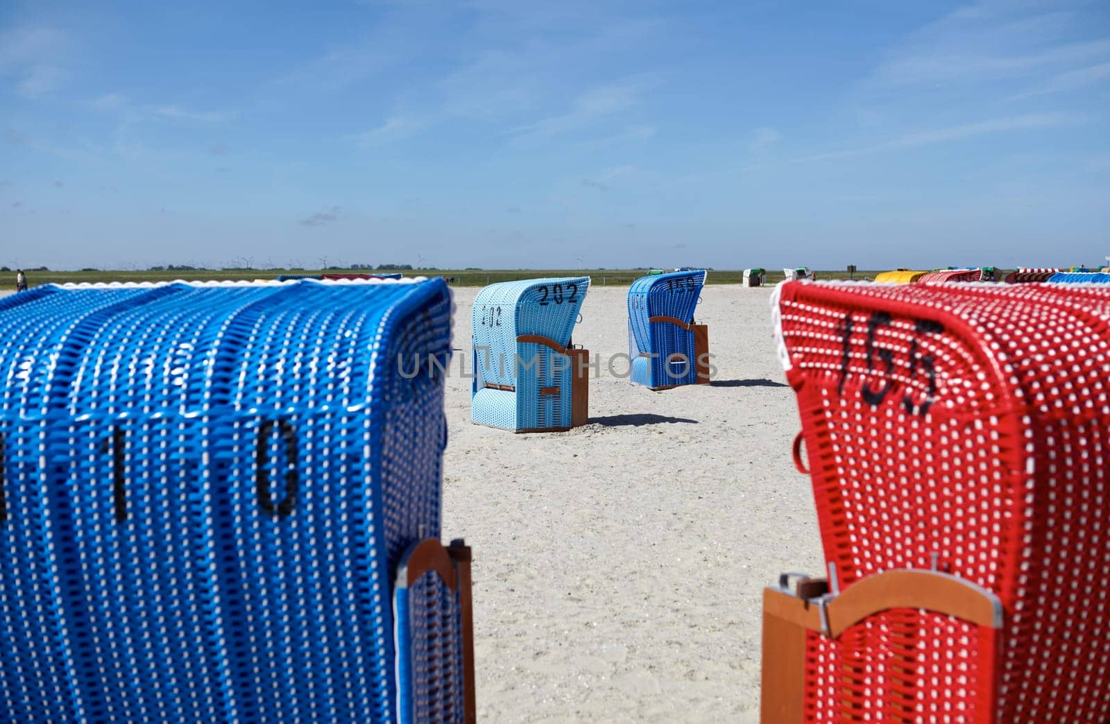 Blue and red beach chair on the beach of the Baltic Sea
