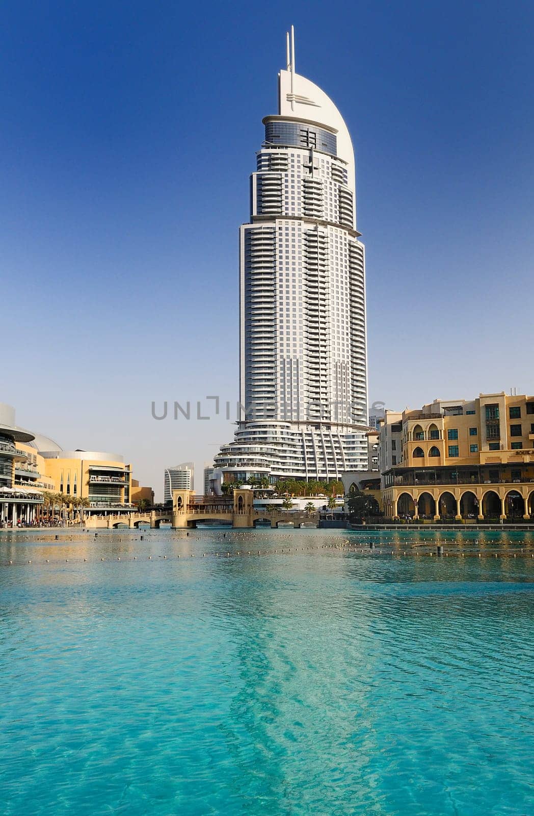 DUBAI, UAE - FEB 22: The Address Hotel in the downtown Dubai area overlooks the famous dancing fountains, taken on 22 February 2012 in Dubai. The hotel is surrounded by a mall, hotels and Burj Khalifa