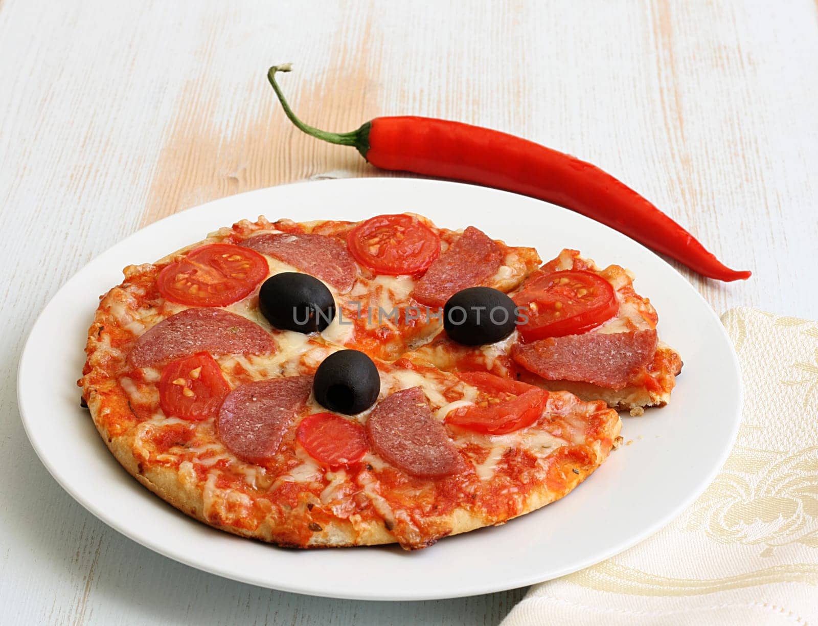 Pizza arrabiata with salami