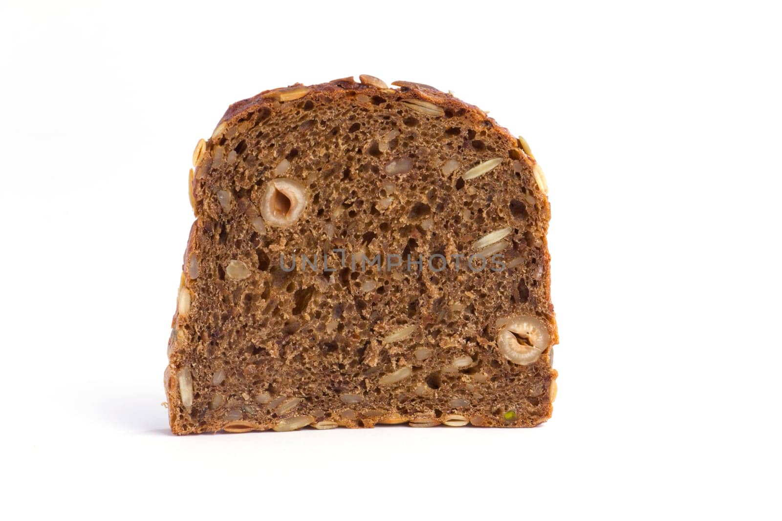 A slice of whole wheat bread on a white background
