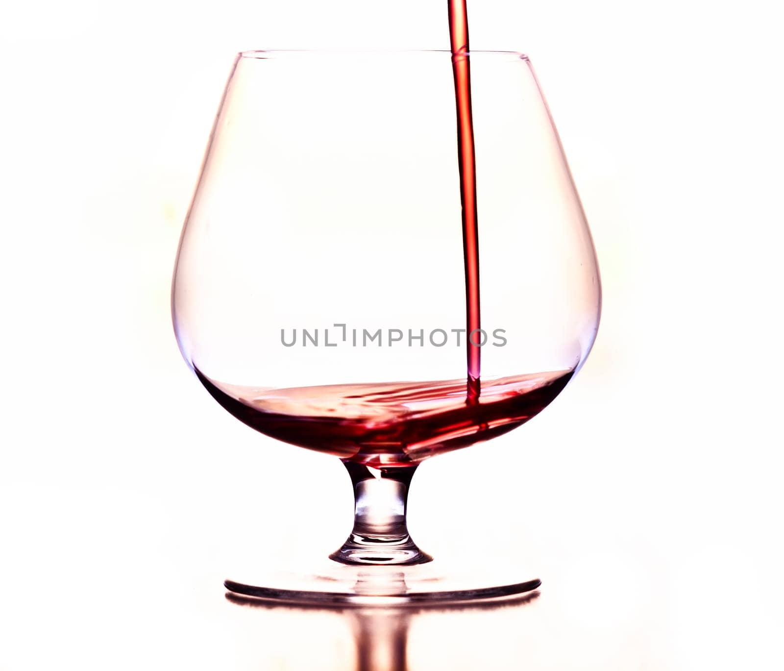 Detail of the wine glass - pouring wine