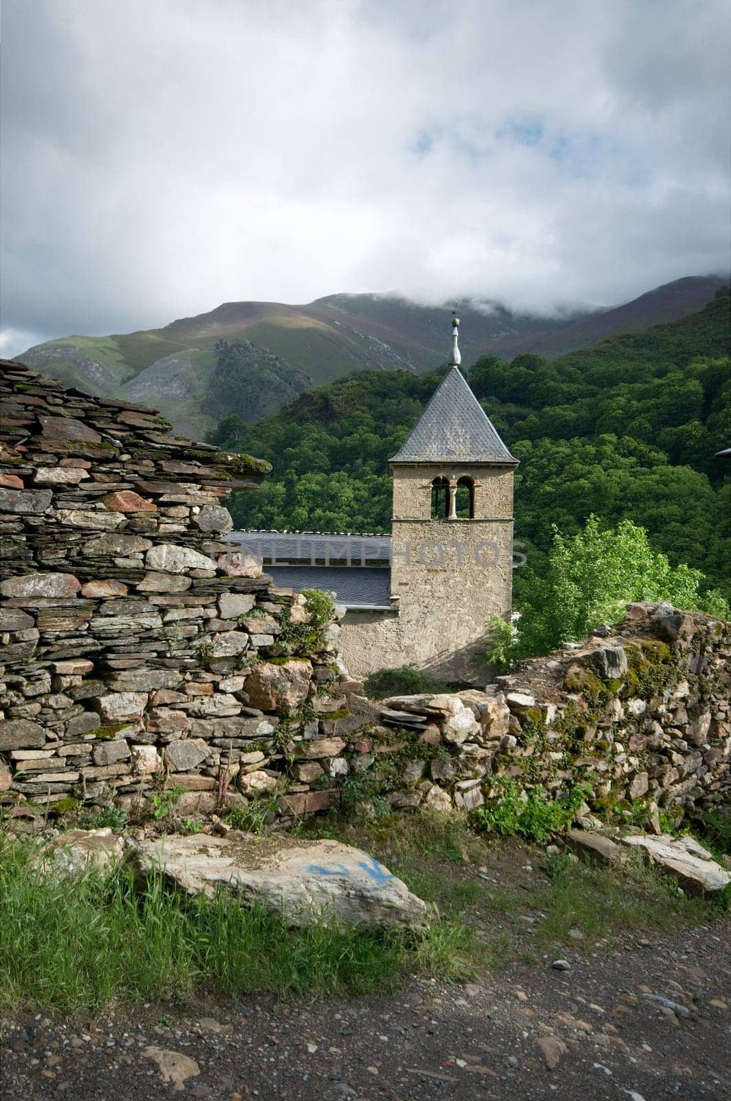 Old medieval church and stone wall at Northern Spain