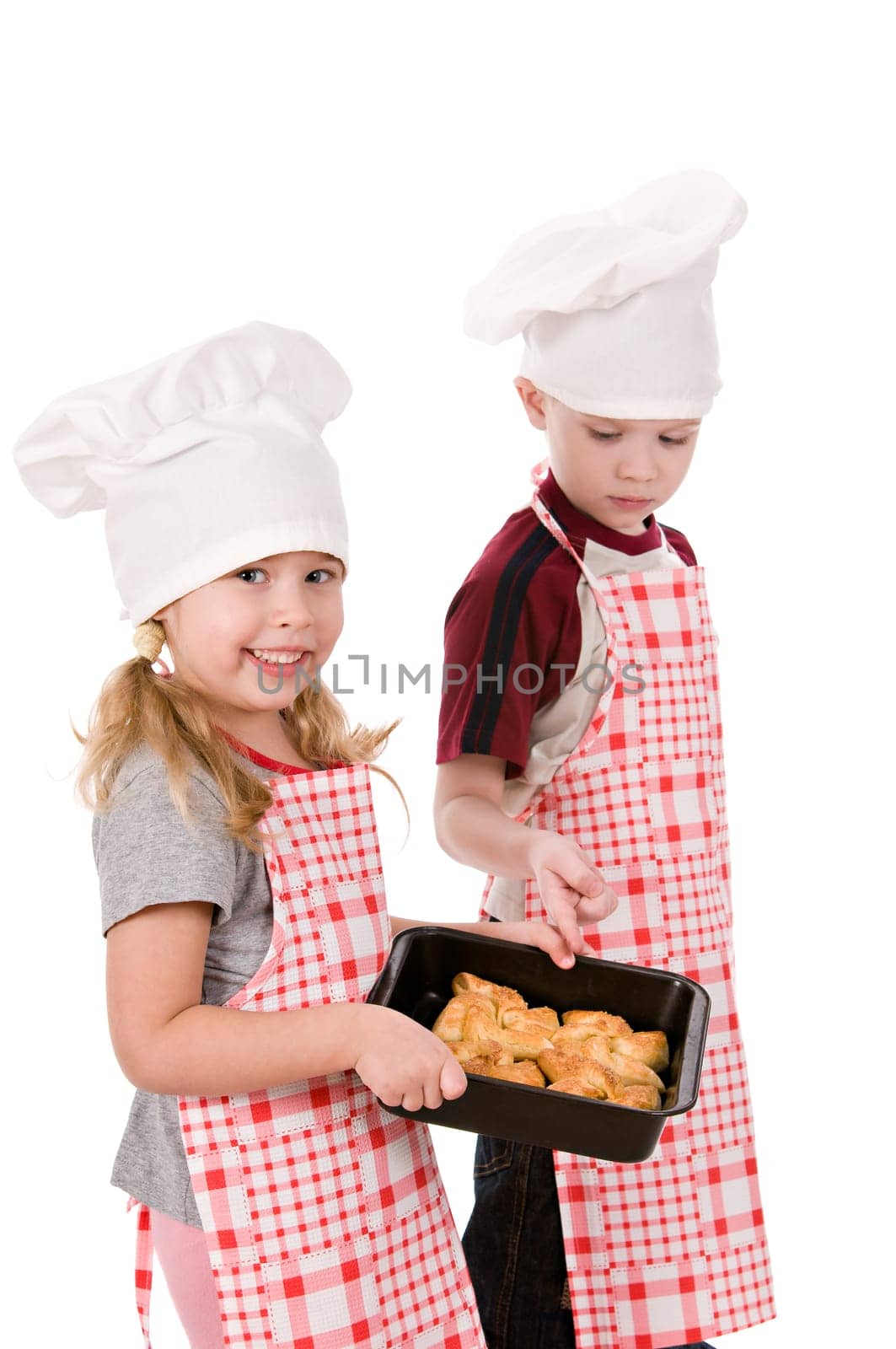 two children in the chef&#039 s hat isolated on white background