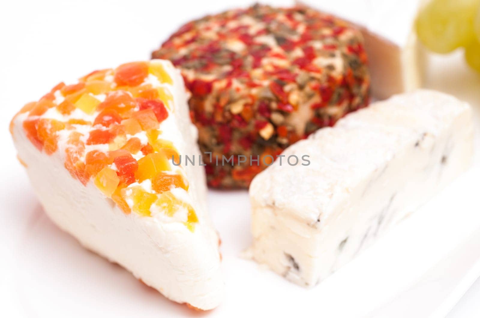 Four different types of cheese against a white background