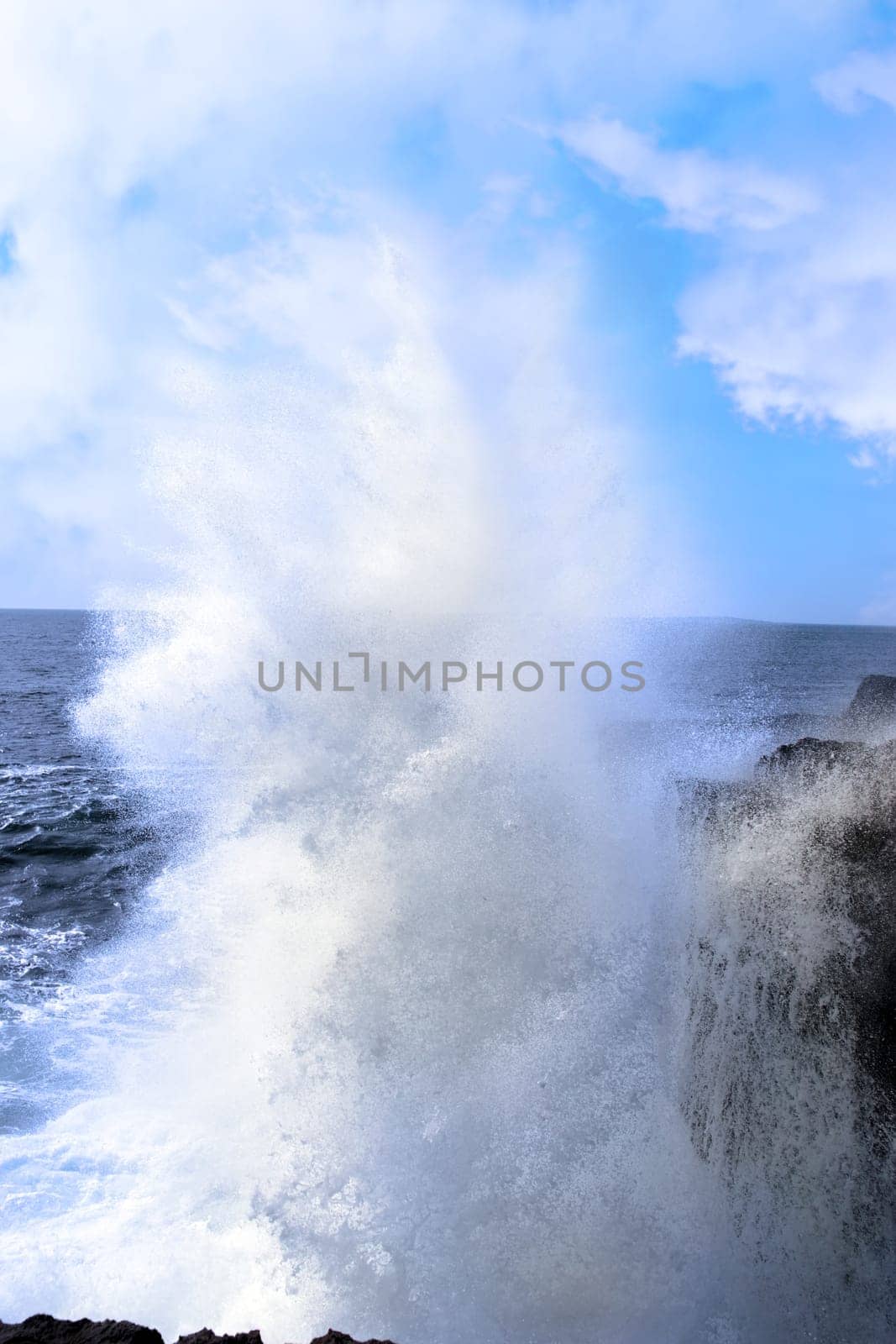 cliffs and coastline of the burren in county clare ireland with giant waves crashing on the rocks