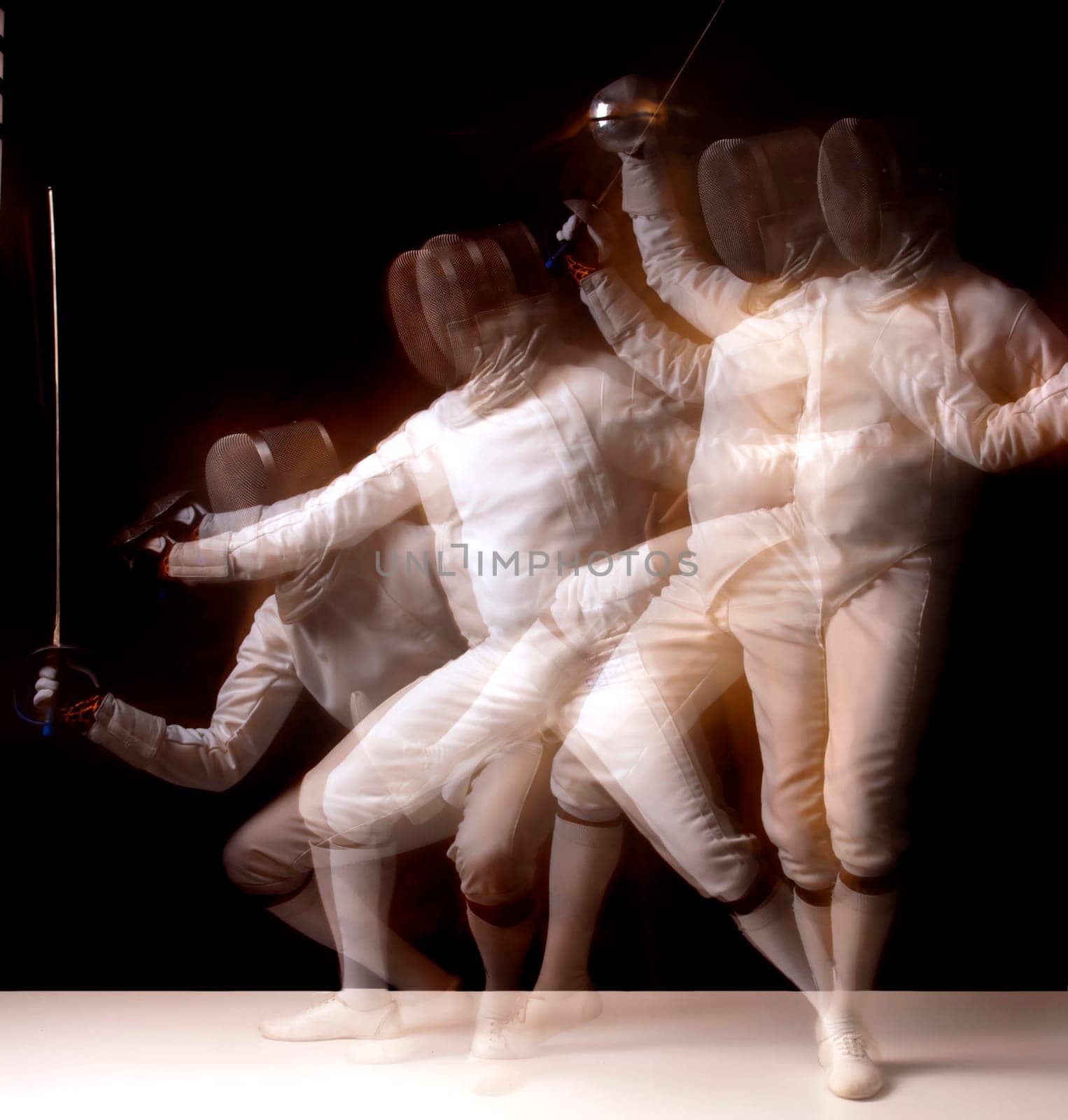 Male fencer isolated in a dark background