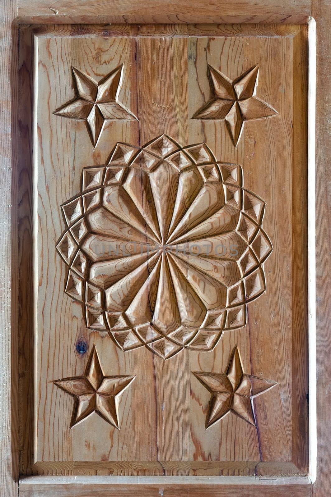 floral tars motifs carved on the old wooden doors. detail