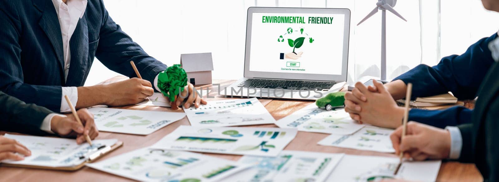 Business people in green company planning eco-friendly strategy. Trailblazing by biancoblue