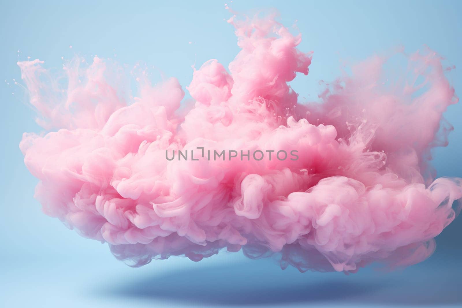 Soft pink ink in water. Pink lush ink cloud on blue background. Abstract background.