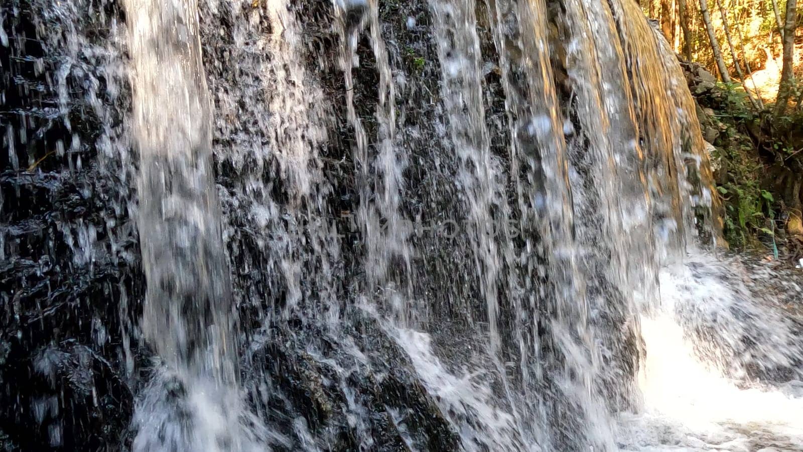 Waterfall of Lourido river in the park of the Estanislau fountain in Maceda - Ovar, Portugal.