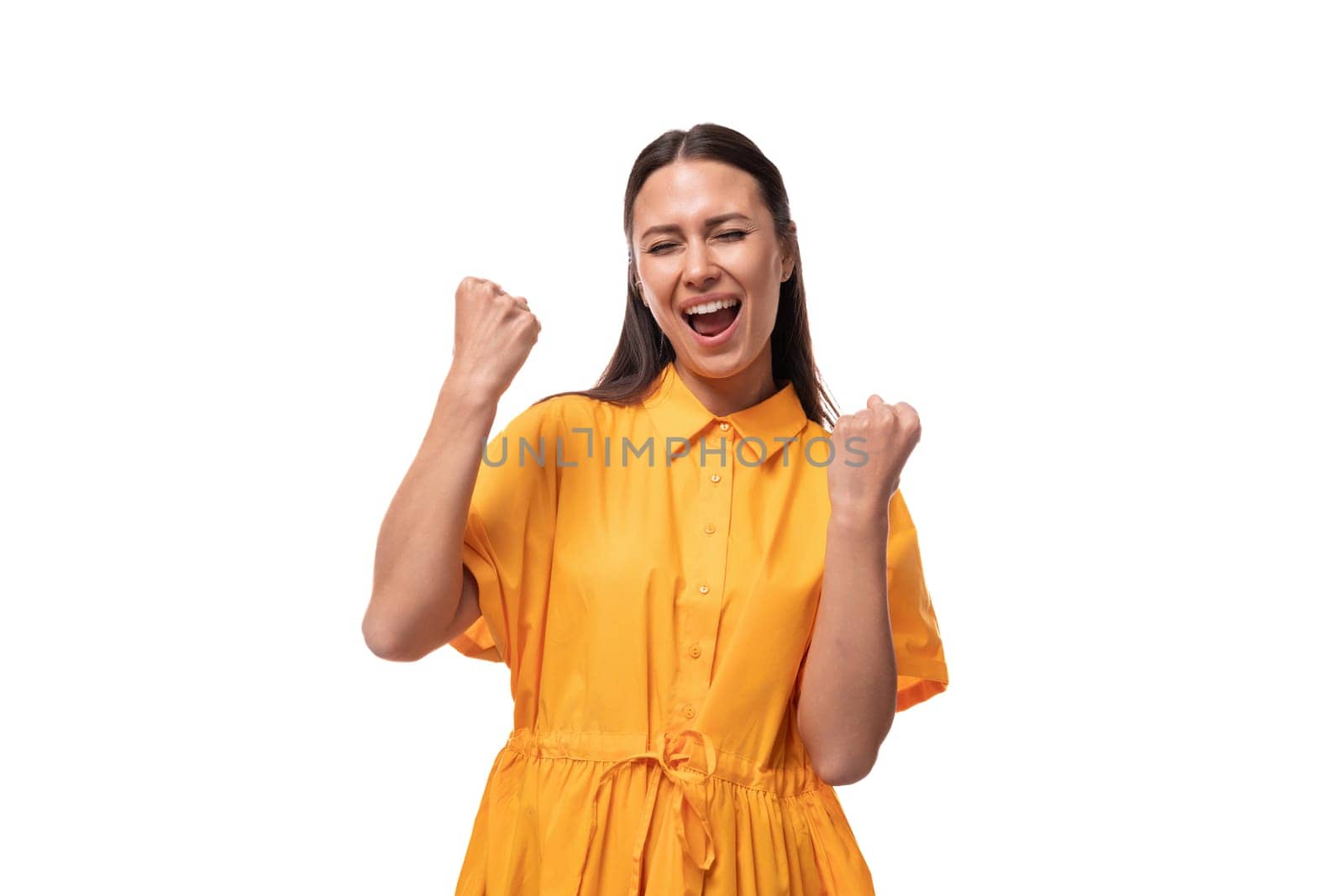 smiling young woman dressed in a summer yellow dress on a white background by TRMK