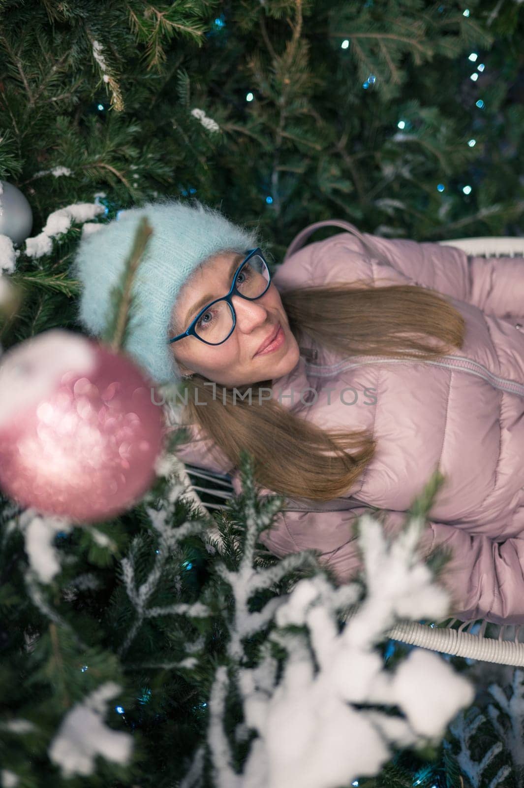 Pretty woman with fir tree. Xmas holidays, New Year or Christmas concept