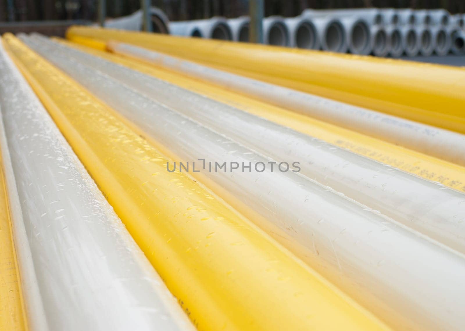 stacked yellow pvc pipes