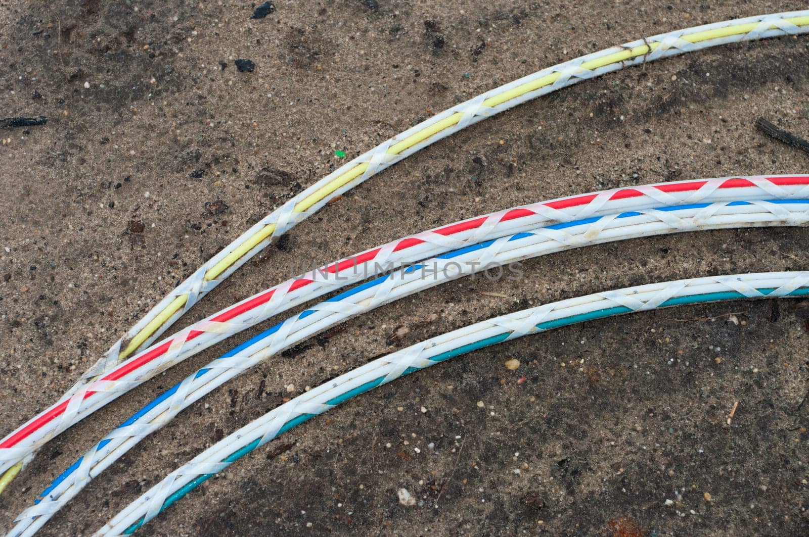 green fiber cable ready to go into the ground on a newly build industrial area