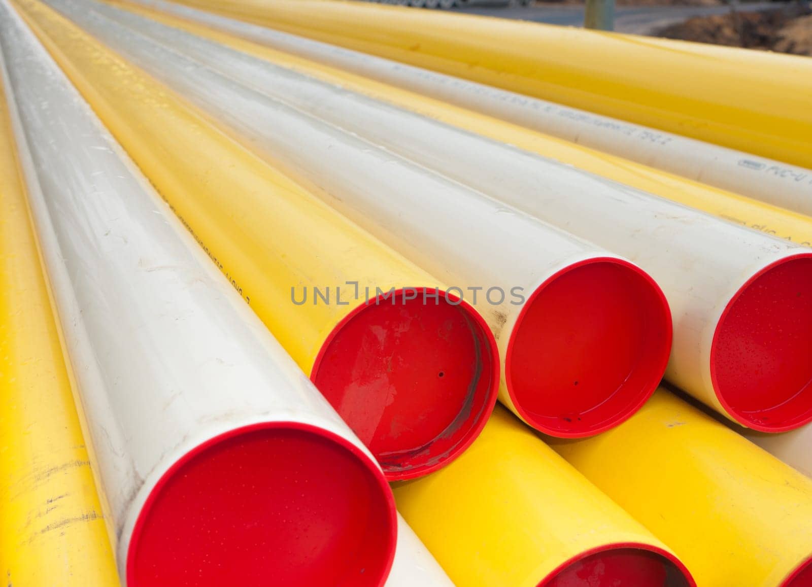 stacked yellow pvc pipes