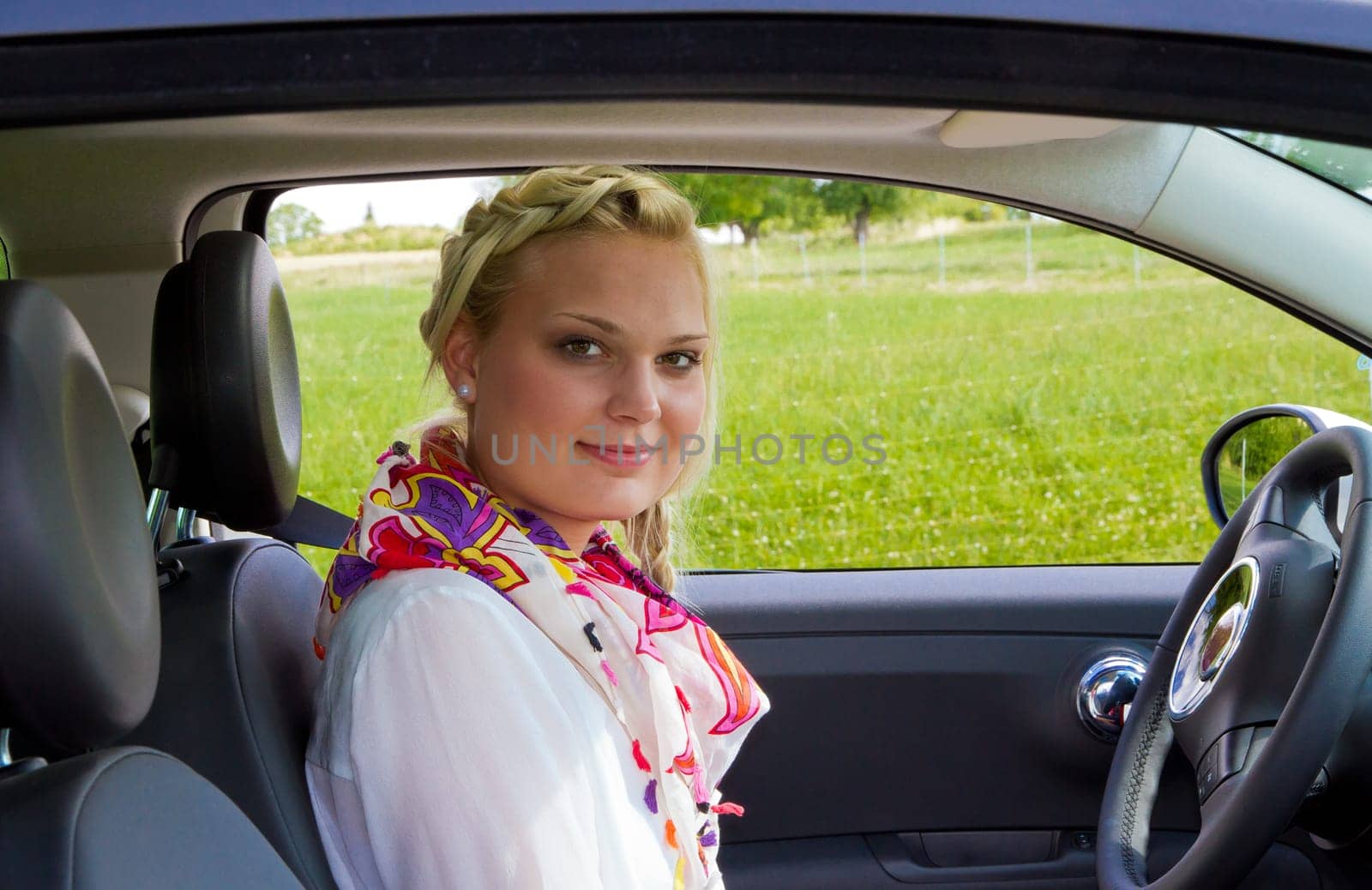 Young businesswoman in car