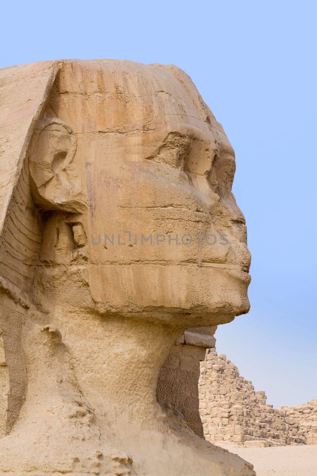 Focus on the stone face of the Egyptian Sphinx in Giza