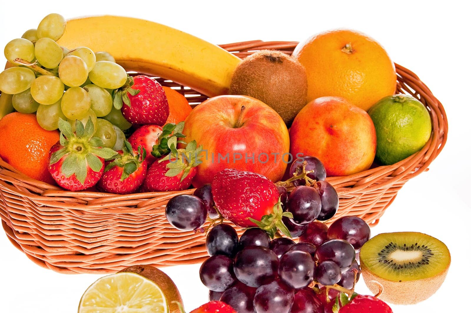 Various fresh ripe fruits placed in a wicker basket