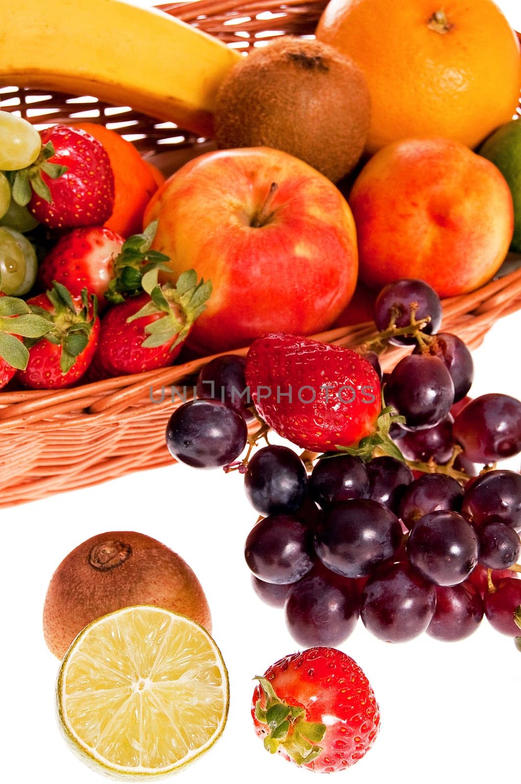 Various fresh ripe fruits placed in a wicker basket