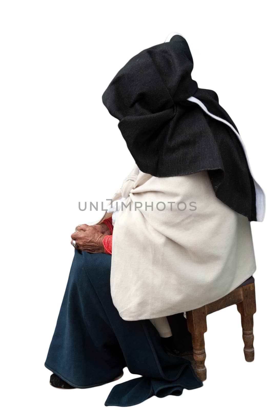 elderly indigenous woman in traditional dress on white background