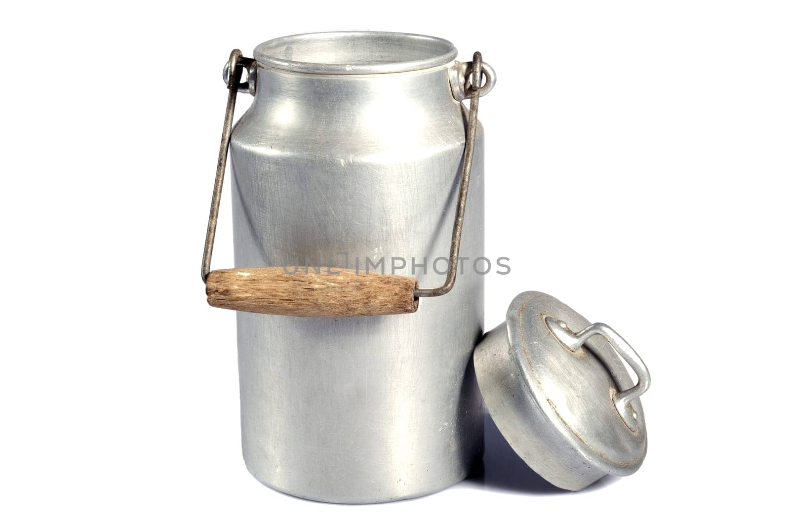 old aluminum milk can on a white background