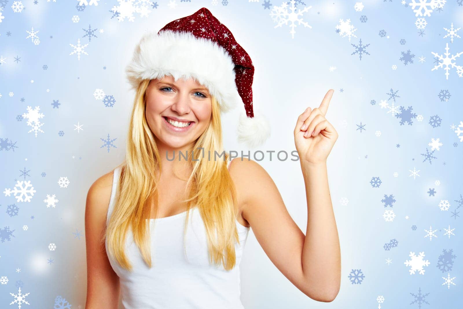 Happy young beautiful woman at christmas with christmas background