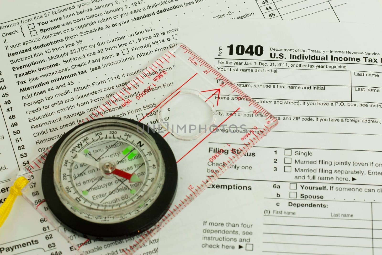 tax form with a compass, guidance concept