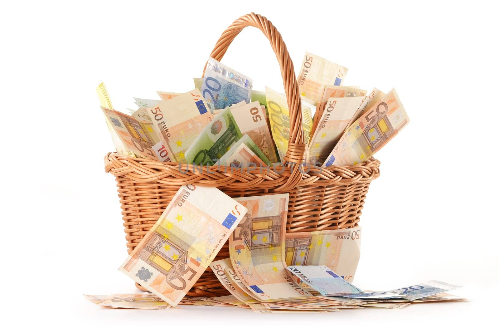 Composition with Euro banknotes in wicker basket. European Union currency