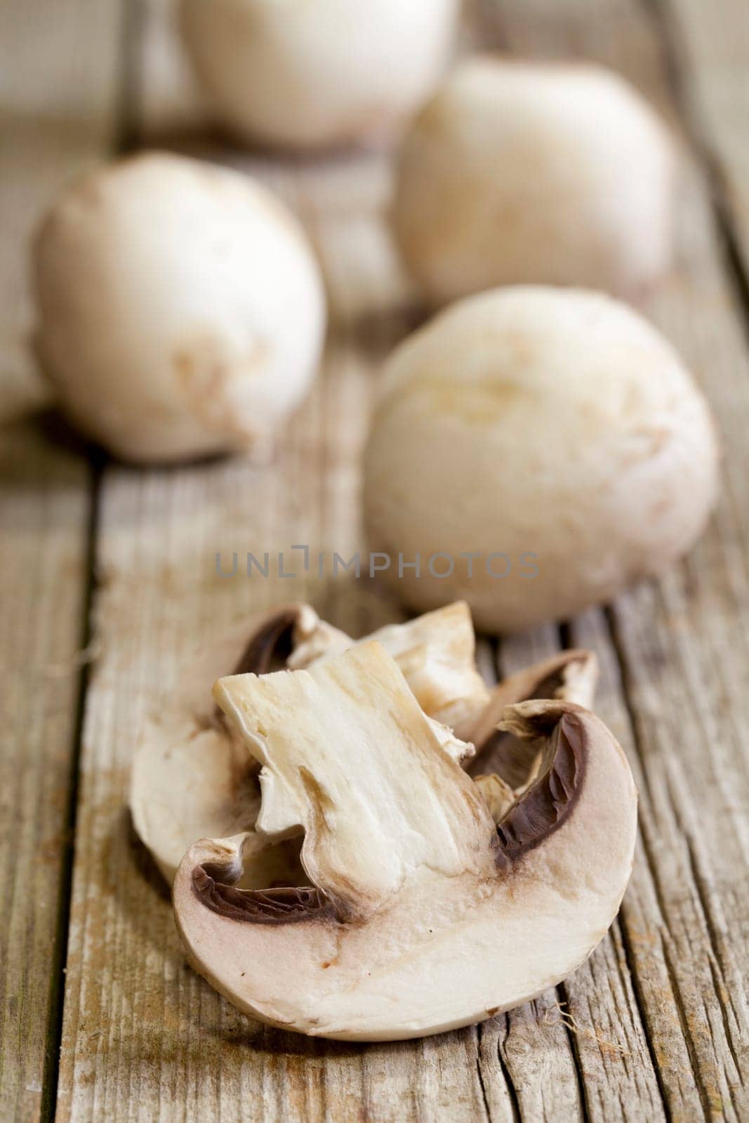 Fresh mushrooms on a brown wooden board