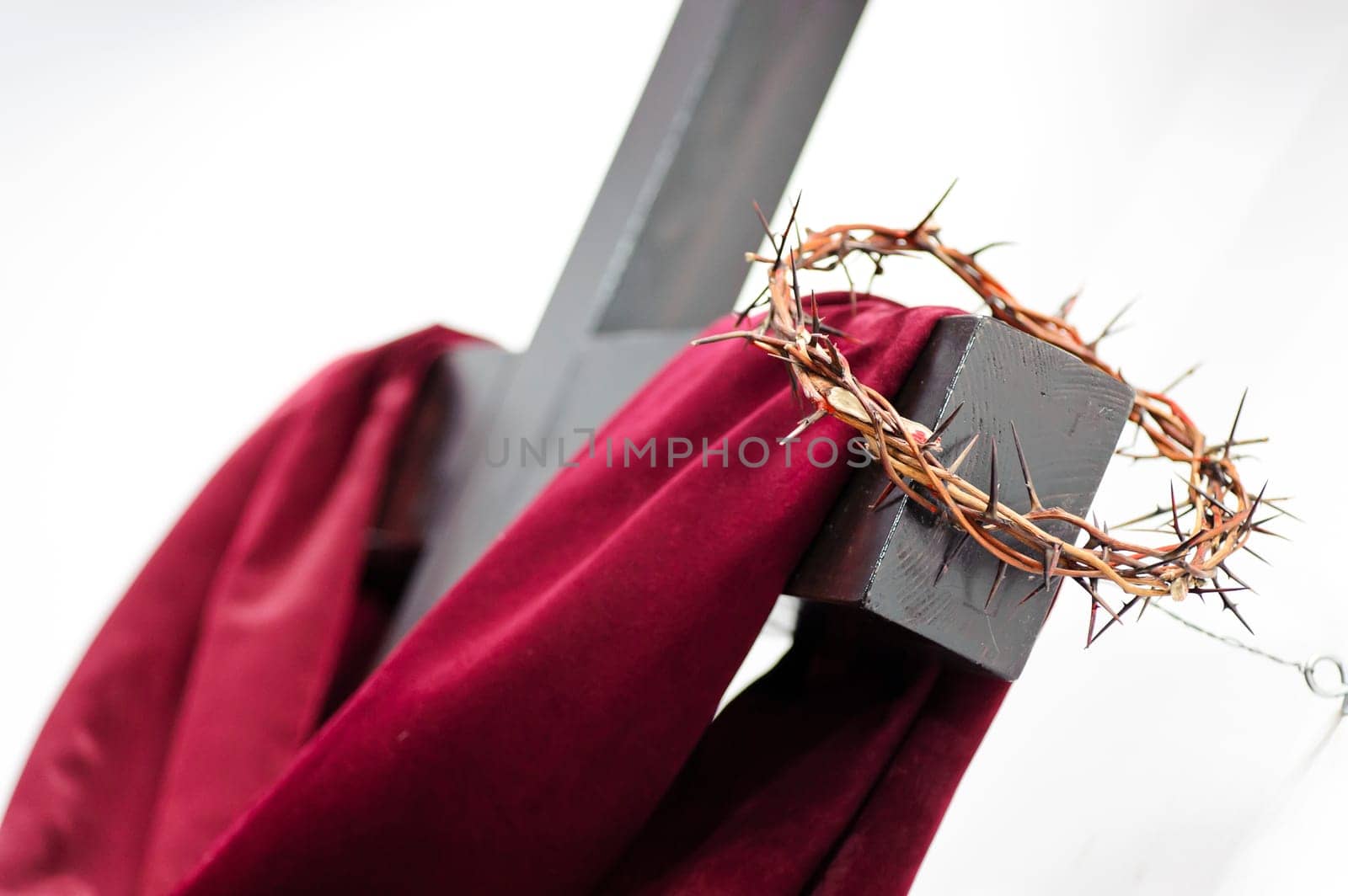 Crown of thorns hung around the Easter cross