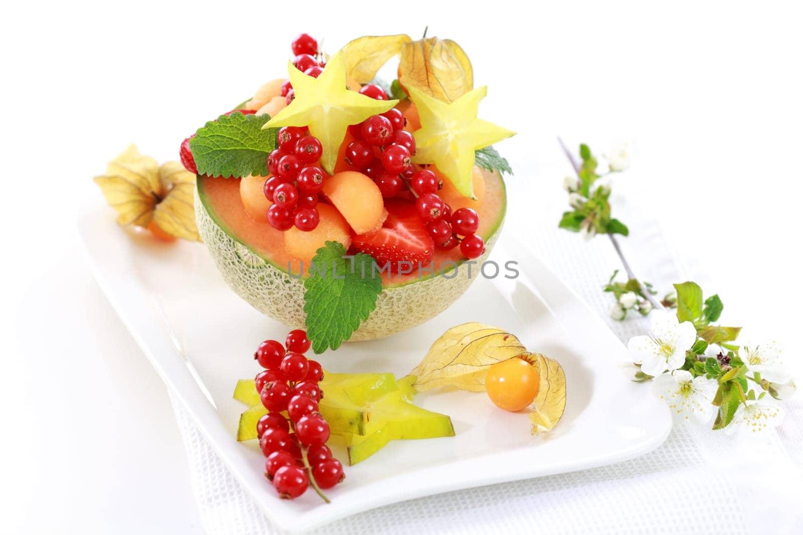 Delicious fresh fruits served in melon bowl as dessert